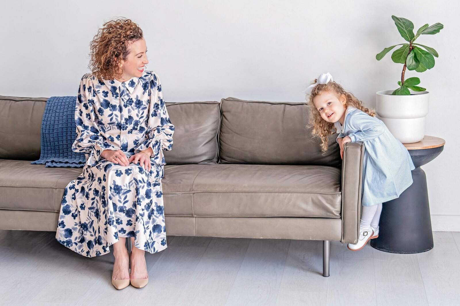 A mom and daughter sitting on a couch at the Lumen Room in Austin, TX | Austin Mommy and Me Photographer