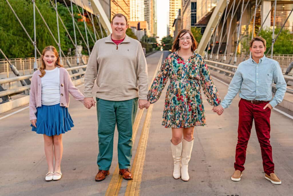 Family standing on the butterfly bridge in downtown austin