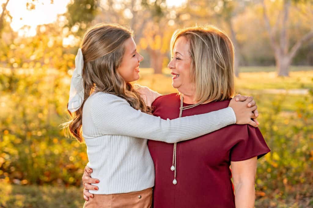 A grandma and grandaughter posing for a picture in Old Settlers Park