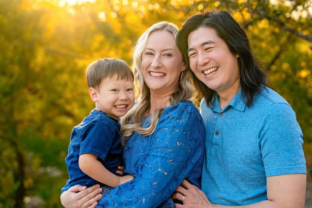 Vivid autumn scene with happy family, professional outdoor photography in Austin, TX.